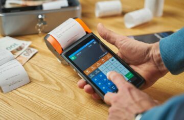 photo of a person printing a receipt