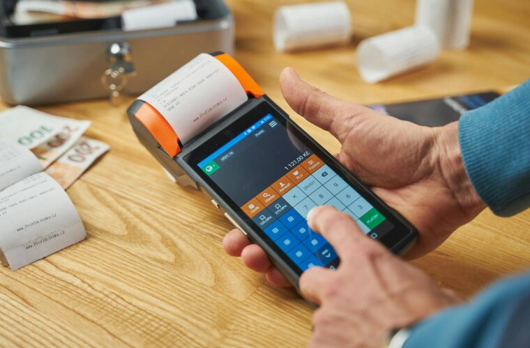photo of a person printing a receipt